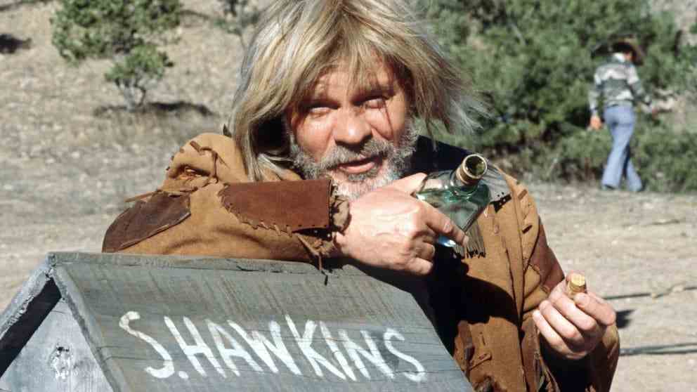 Ralf Wolter as the cranky trapper Sam Hawkins in 
