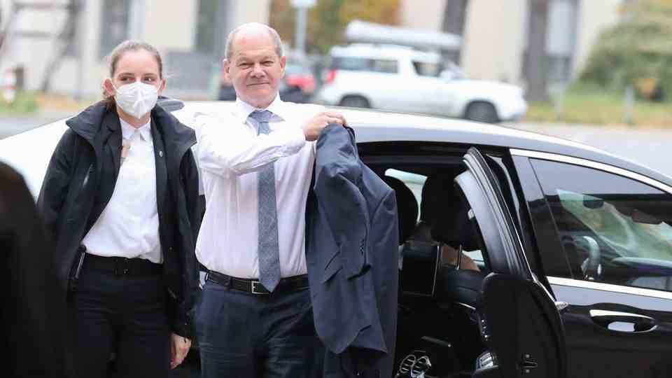 Chancellor Olaf Scholz gets out of his official car