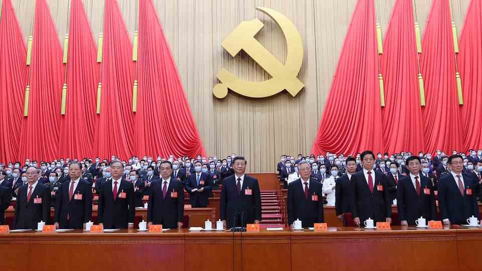 China's head of state Xi Jinping amidst party officials 