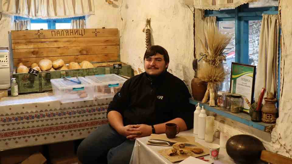 Yaroslav Burkivskyj is sitting in his bakery in Bucha. 