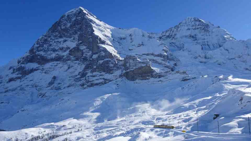 The Jungfrau Railway at the foot of the snowy north face of the Eiger.