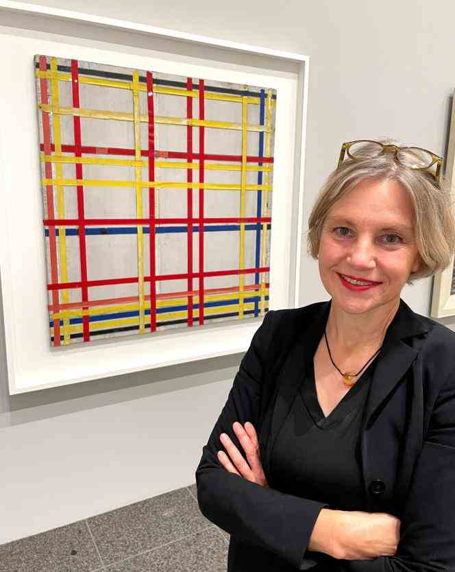 Curator Susanne Meyer-Büser poses in front of Piet Mondrian's 