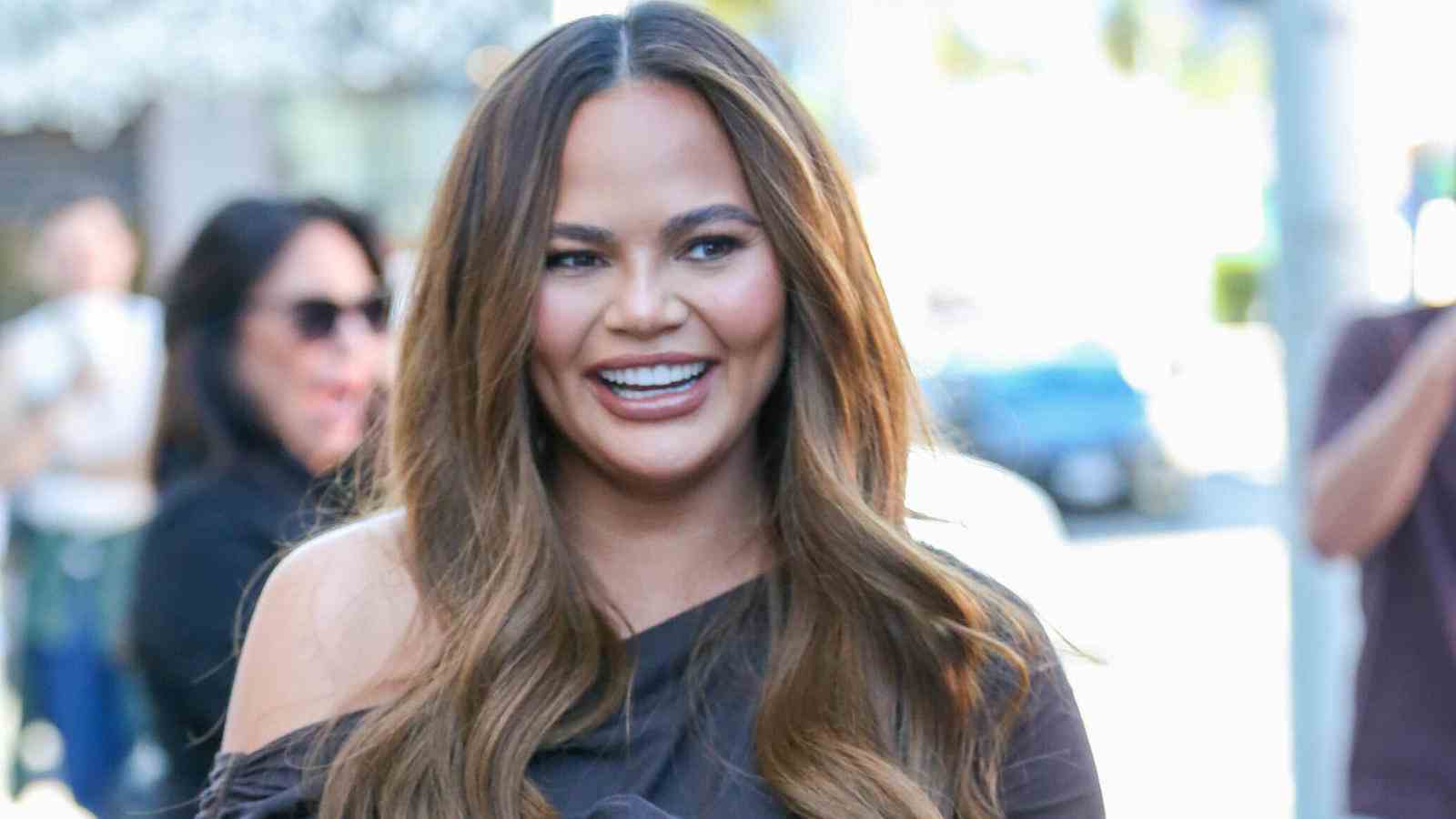 Chrissy Teigen is completely naked with a baby bump