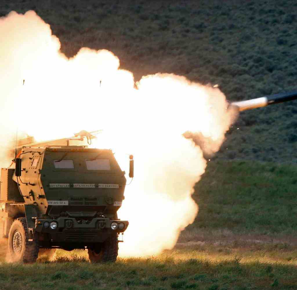FILE - A launch truck fires the High Mobility Artillery Rocket System (HIMARS) produced by Lockheed Martin during combat training in the high desert of the Yakima Training Center, Washington on May 23, 2011. Ukraine has received about a dozen American-built HIMARS multiple rocket launchers and has used them to strike Russian ammunition depots, which are essential for maintaining Moscow's edge in firepower. (Tony Overman/The Olympian via AP, File)