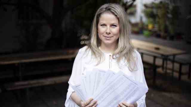 Maternity leave: Natascha Sagorski, 38, shows the forms with the 70,000 signatures for extended maternity leave.