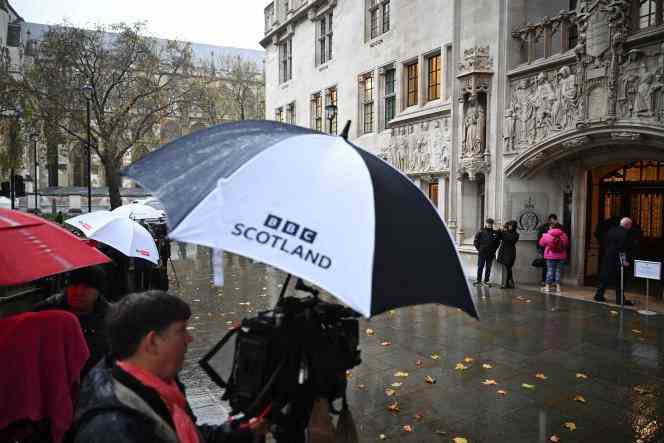 A BBC Scotland cameraman outside the British Supreme Court in London on November 23, 2022. 
