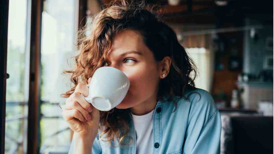 woman drinks a coffee