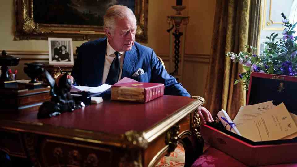 Charles at his desk in Buckingham Palace