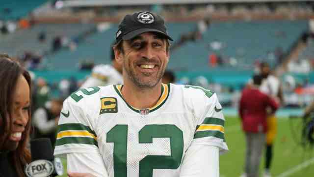 Football in the NFL: Here's the proof: Aaron Rodgers, the highly paid and grumbling quarterback of the Green Bay Packers, can really laugh!