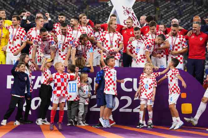 Croatia's players climbed to the podium to receive their bronze medal after their 2-1 victory over Morocco in the World Cup small final on Saturday, December 17, 2022, at the Khalifa International Stadium, in Doha. 