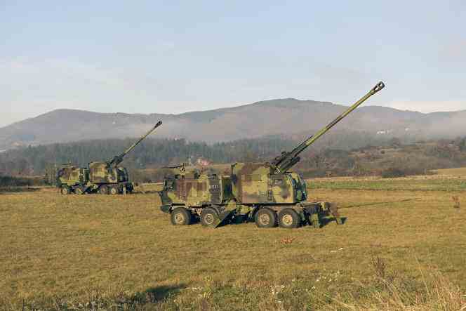 In this photo provided by the press service of the Serbian Defense Ministry, Serbian army howitzers are in position near the border with Kosovo, December 26, 2022.
