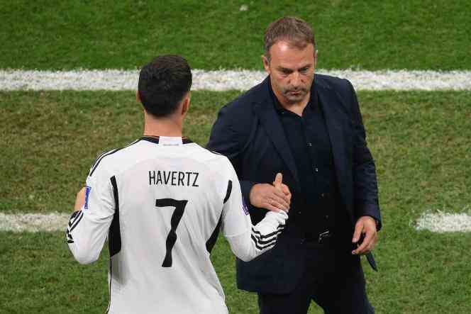 Germany coach Hans-Dieter Flick shakes hands with his player Kai Havertz after his team's victory over Costa Rica in Al-Bayt (Qatar) on December 1, 2022.