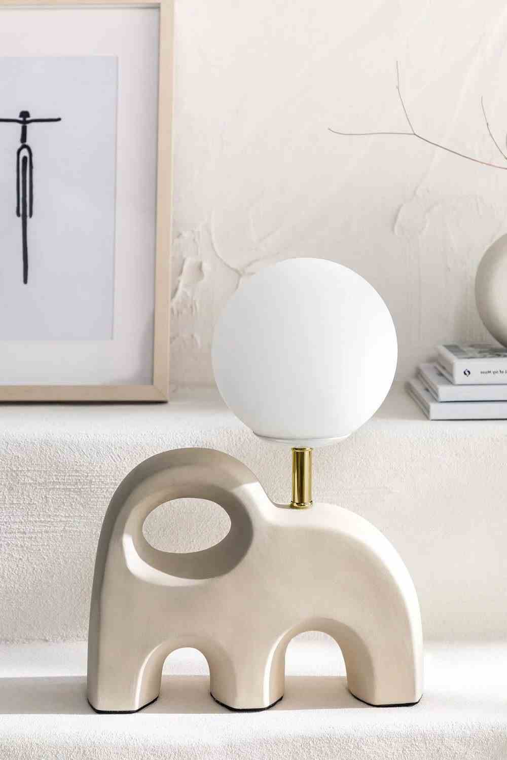 The Table Lamp Illuminates the Arty Interior 