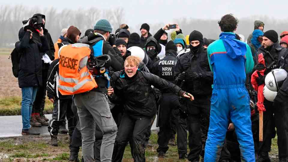 A group of masked police officers met demonstrators near Lützerath