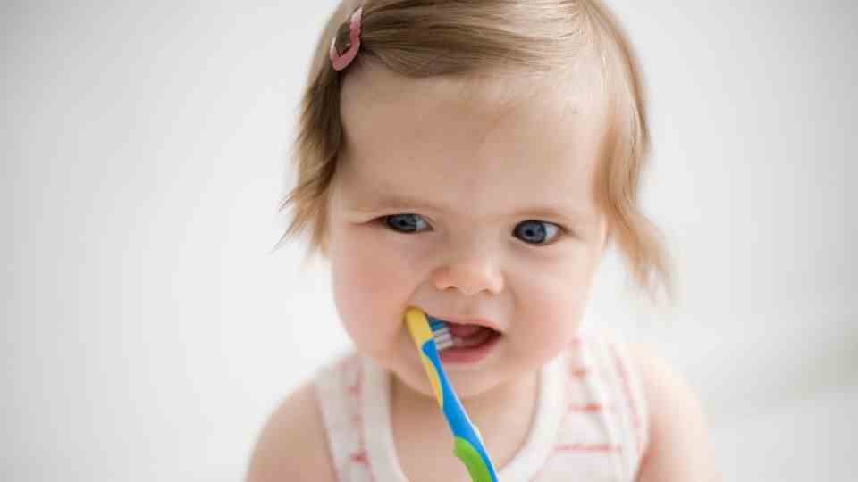 Toddler with toothbrush