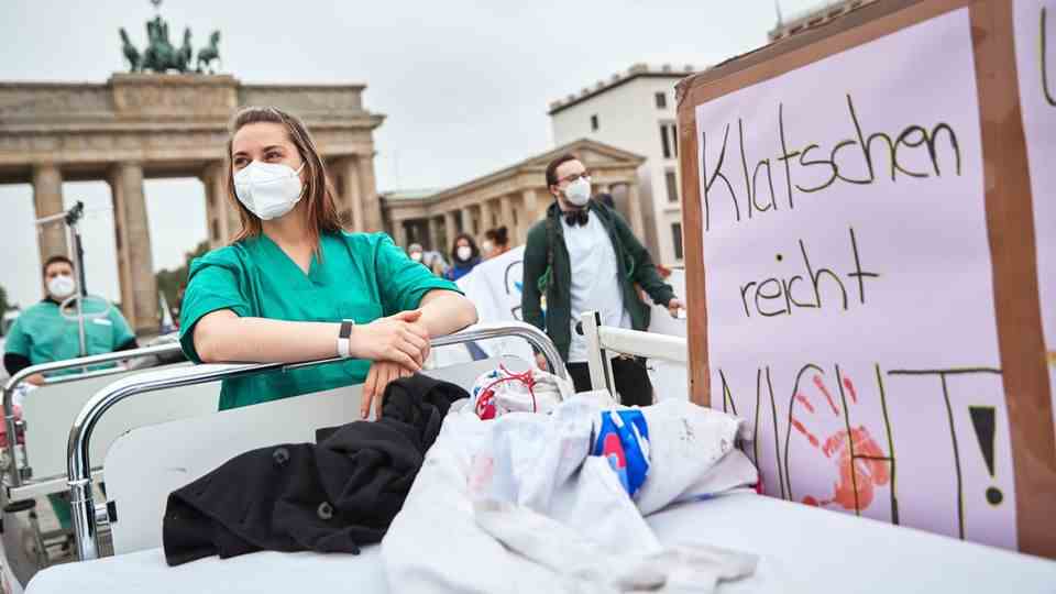 Nursing staff - here in May at a demonstration in Berlin - are among the big losers in a health and social system trimmed for maximum profit