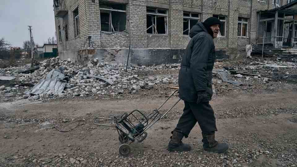A man walks through the completely destroyed streets of Bakhmut.  The city has been under Russian attacks for months.