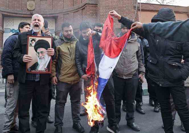 Iranian demonstrators burning the French flag, after the publication of caricatures of Ali Khamenei in 