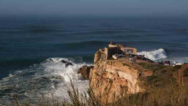 Surf Accident: The "Nazare Canyon" meets the coast in Portugal.  It is five kilometers deep and 170 kilometers long.  And it causes waves to pile up particularly high.