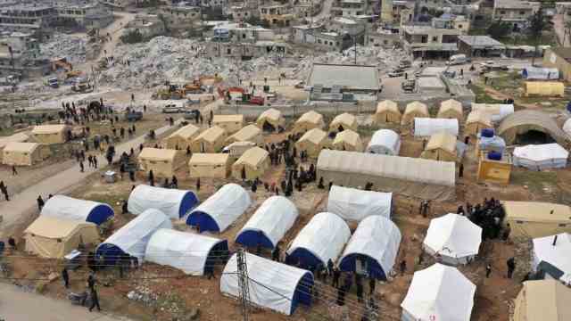 Residents of the city of Harem in Idlib province take refuge in a tent camp after the earthquake destroyed their homes.