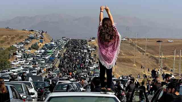 Iran: The protest movement began with the death of Iranian Kurdish woman Mahsa Amini in police custody.  The image is said to show the procession of people heading to her grave in Iran's Kurdish province on the 40th day after her death.
