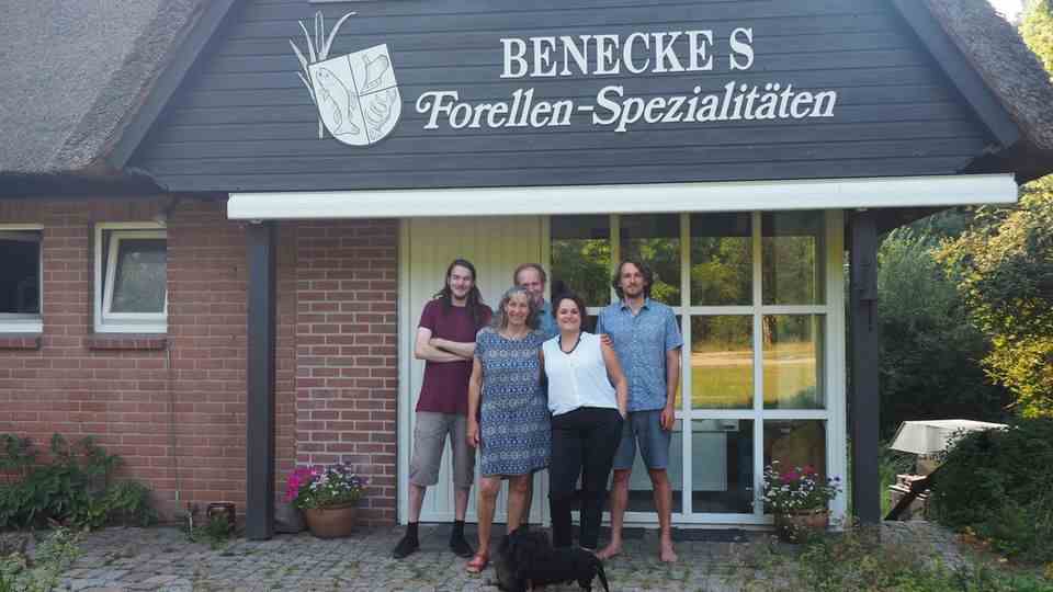 The Benecke family in front of the farm shop of their fish farm