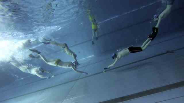 Underwater hockey: At kick-off, the fastest player from each team swims to the puck in the middle.