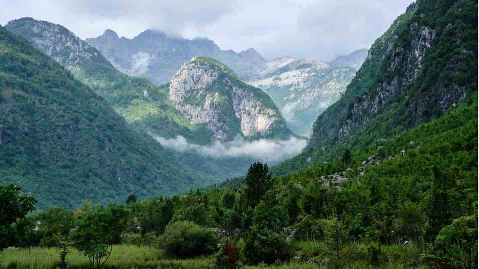 Albania - Far away from it all: Karst mountains rise at the end of the Theth Valley in northern Albania.  The warm summers produce a diverse flora