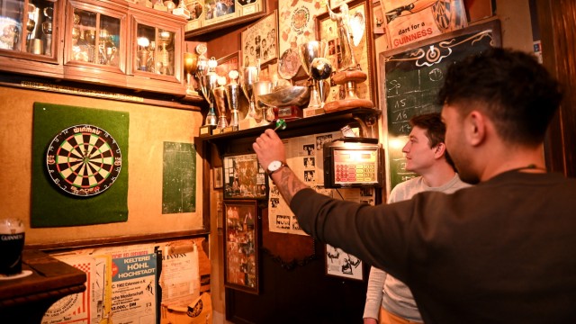 The Old Irish: Guests play a round of darts.