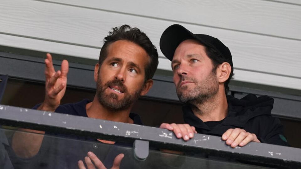 Ryan Reynolds (right) and his buddy Paul Rudd follow the game from the stands