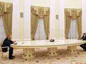 Vladimir Putin and Olaf Scholz at the table in the Kremlin.