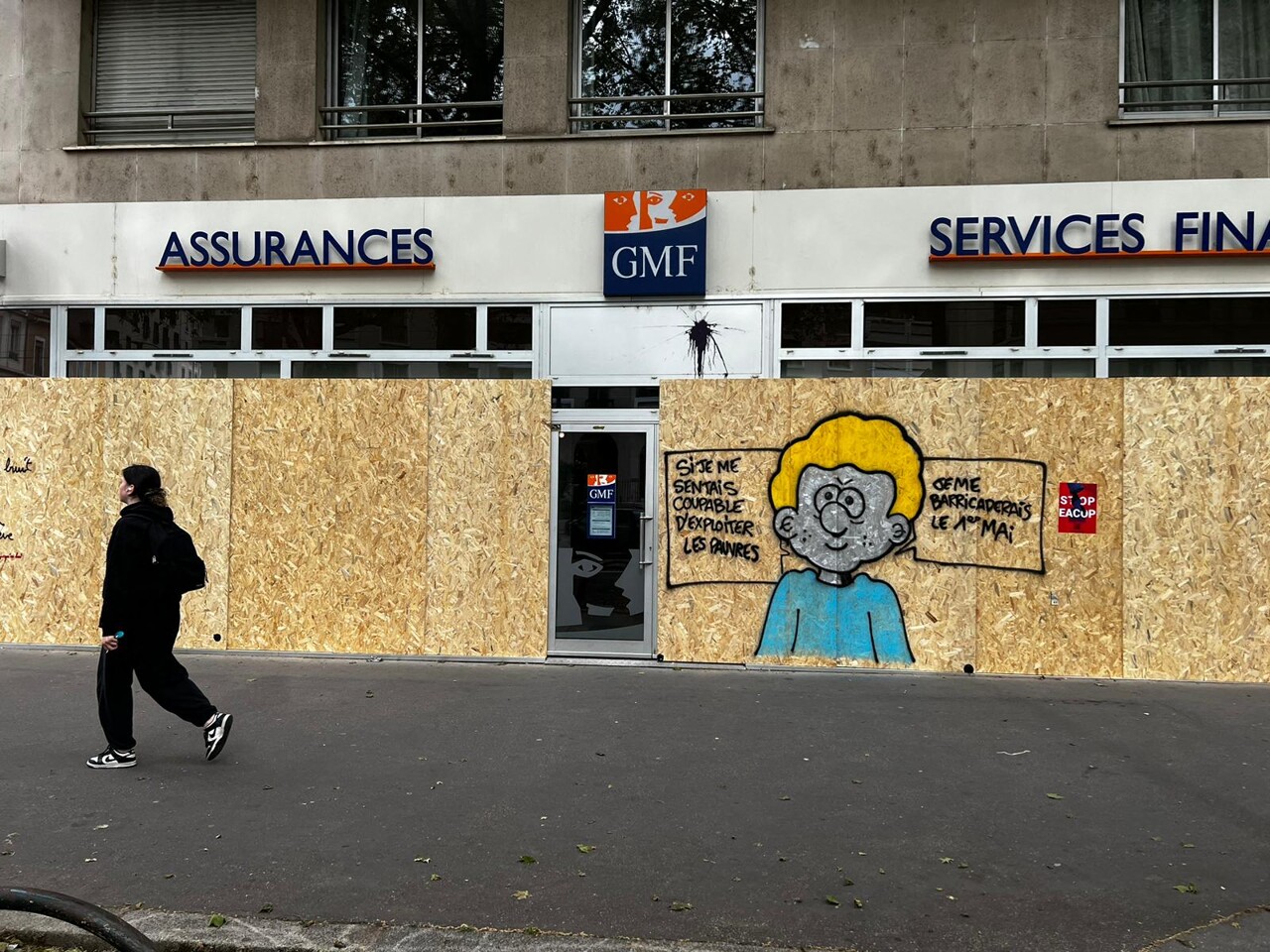 An insurance agency protected by wooden signs near Saxe-Gambetta on May 1 in Lyon.