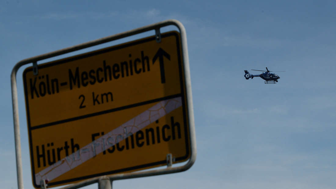 A police helicopter circles over the accident site in Hürth near Cologne.