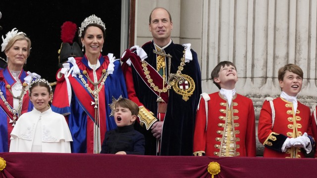 People: Charlotte, Louis and George (far right) with their parents William and Kate on the balcony of Buckingham Palace.