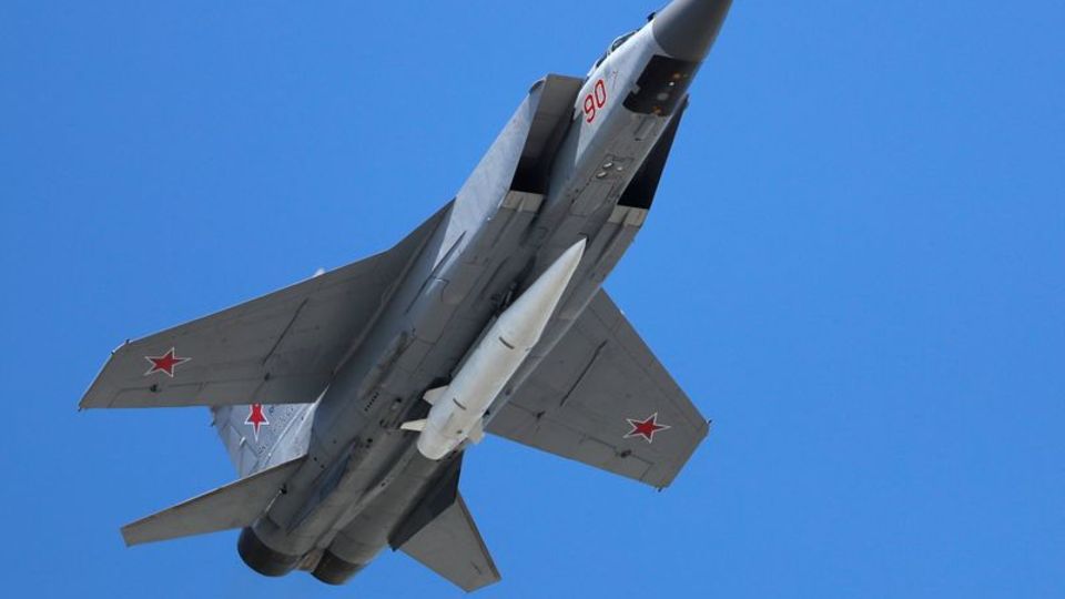 A Russian Air Force Mikoyan MiG-31 interceptor flies loaded with e at the Russian Victory Day military parade
