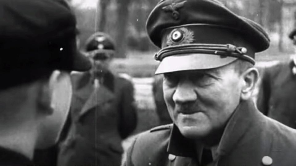 The German newsreel showed how Hitler honored the boys.  It didn't show how badly the dictator suffered from shaking paralysis.  These scenes were cut out.