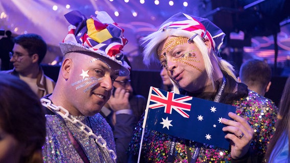 Two fans have masked and dressed up.  © Eurovision.tv Photo: Andres Putting