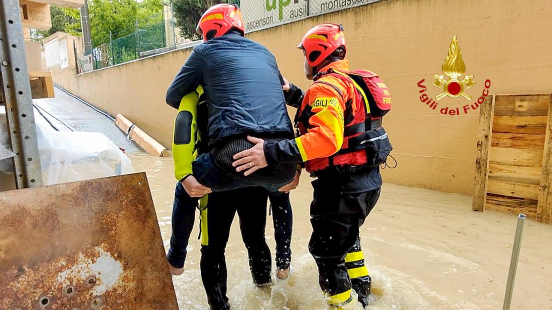 Heavy floods in Italy: Firefighters rescue people from flooded houses. 