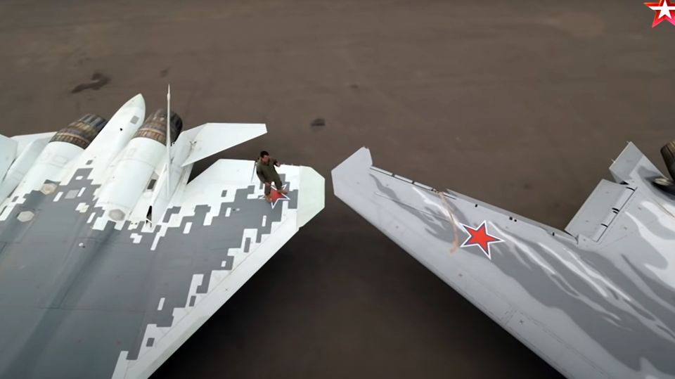 The military broadcaster's video shows the drone (right) next to the SU 57.
