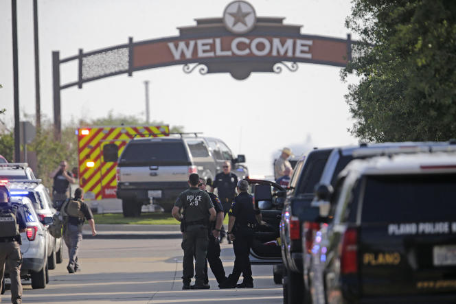 Police forces outside the entrance to the Allen Premium Outlets mall in Allen, Texas, where a shooting took place on May 6, 2023.