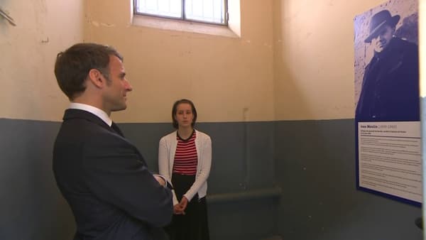 Emmanuel Macron in the cell where the resistance fighter Jean Moulin was imprisoned, in the Montluc prison, which has since become a memorial, in Lyon, on May 8, 2023, during a visit by a man to the resistance fighter.