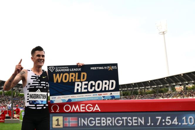 Jakob Ingebrigtsen celebrates the 2-mile world record, Friday June 9, 2023, in Paris.
