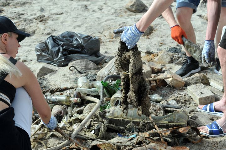 Residents of Zaporizhia take part in a collection to clean up the dried up bank of the Kakhovka reservoir (Ukraine), June 10, 2023. (ALBERT KOSHELEV/ SIPA / SIPA)