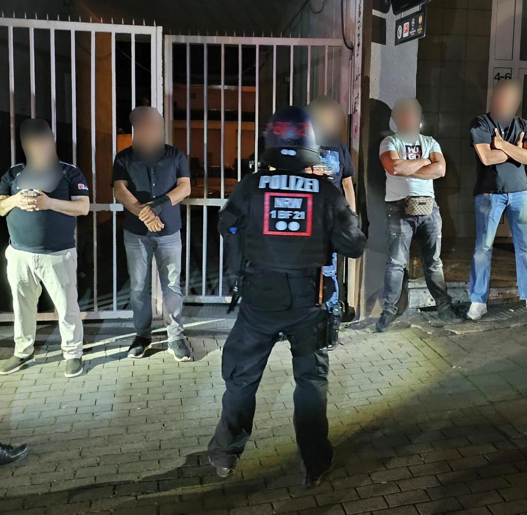 Police officers are guarding some of the young men who wanted to fight in Essen