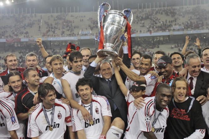Silvio Berlusconi in the middle of AC Milan players after the victory against Liverpool in the Champions League final soccer match May 23, 2007 at the Olympic stadium in Athens.