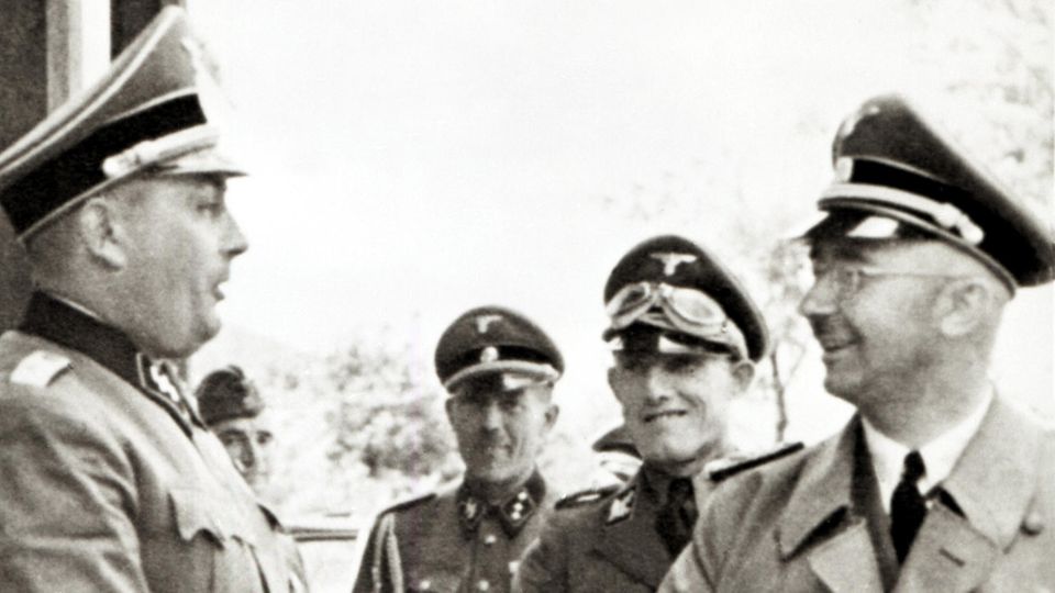 Rudolf Höß (left), the commandant of Auschwitz, welcomes Reichsfuhrer SS Heinrich Himmler during a visit to the concentration camp