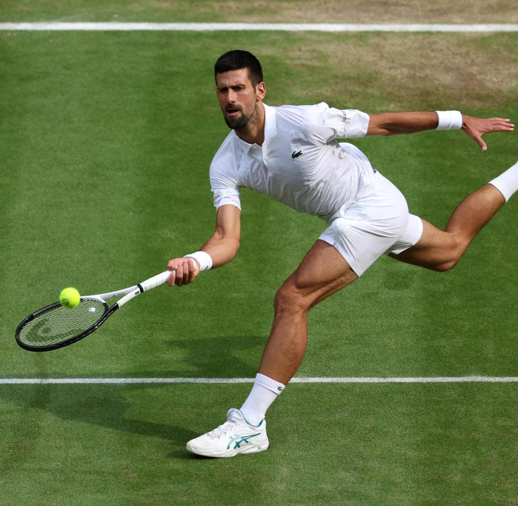 LONDON, ENGLAND - JULY 16: Carlos Alcaraz of Spain plays a forehand in the Men's Singles Final against Novak Djokovic of Serbia on day fourteen of The Championships Wimbledon 2023 at All England Lawn Tennis and Croquet Club on July 16, 2023 in London, England.  (Photo by Patrick Smith/Getty Images)