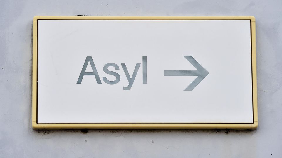 A sign that says "asylum" hangs on a wall in a state initial reception for asylum seekers (LEA).
