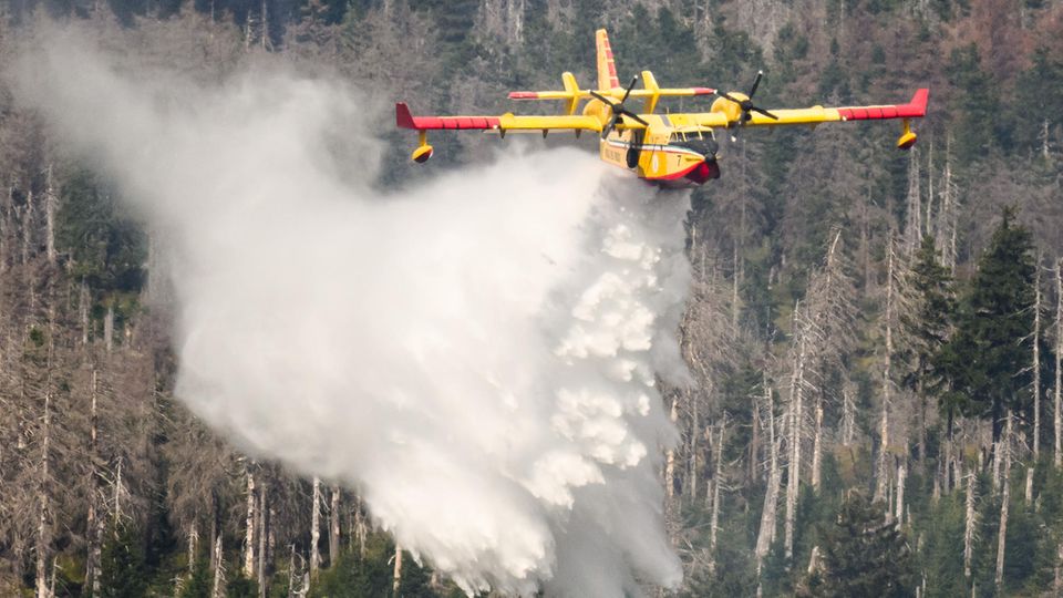 An Italian fire-fighting plane helps out with a forest fire on the Brocken