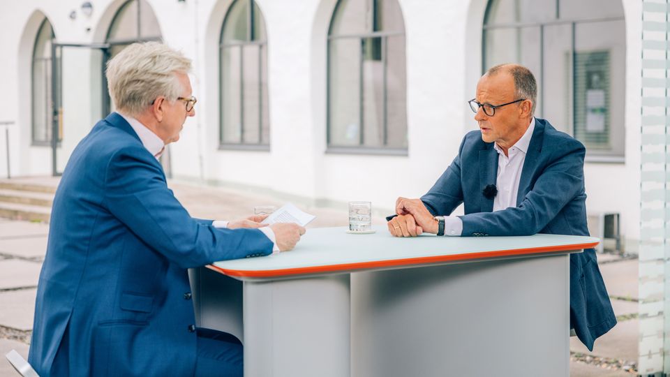 The CDU chairman Friedrich Merz sits with Theo Koll at the ZDF summer interview